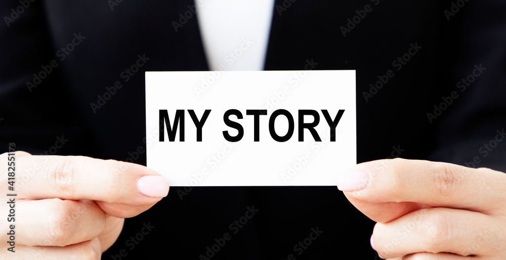 The girl businessman puts in her pocket a card with the text OF MY STORY. The girl businessman puts in her pocket a card with the text OF MY STORY.
