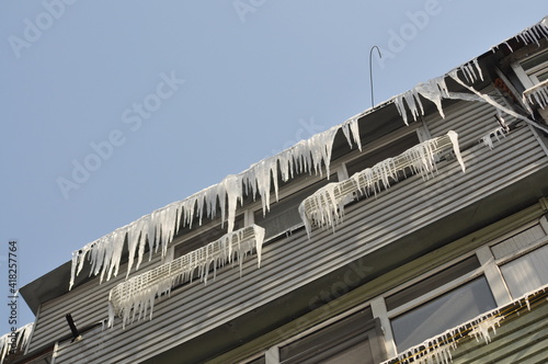 Icicles hang from the roof of the balcony