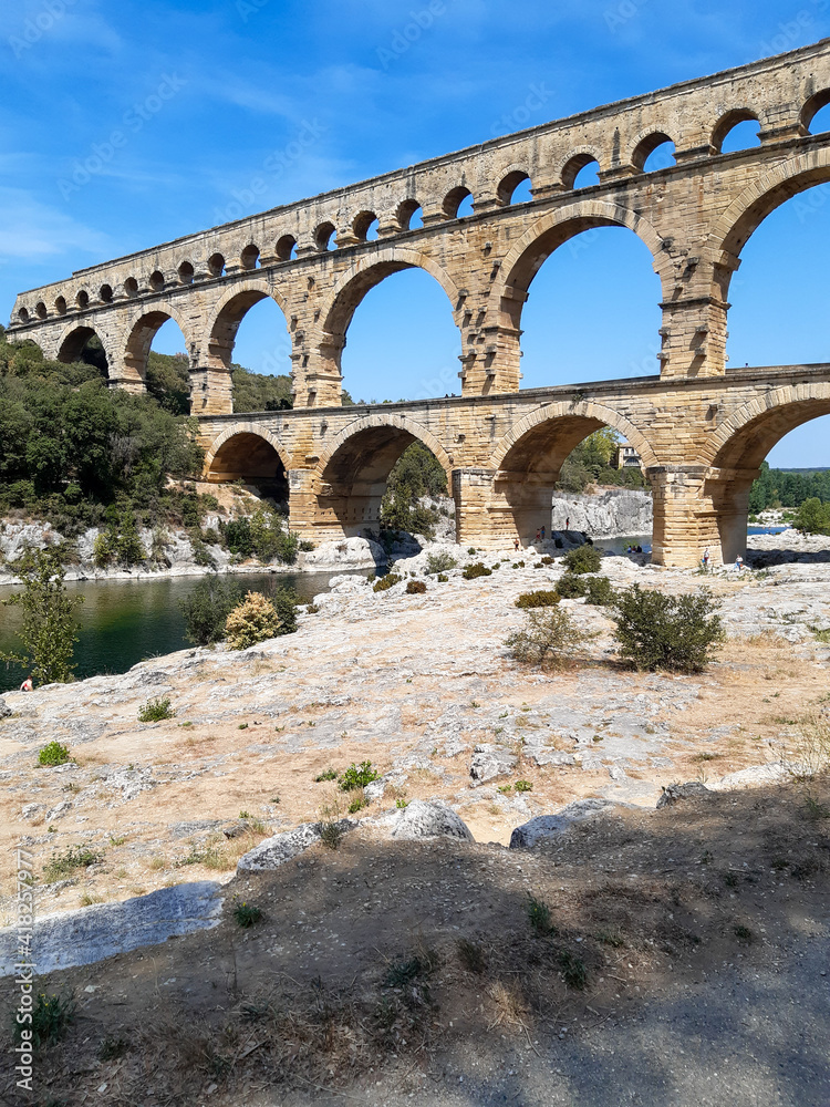 Three-tiered aqueduct Pont du Gard bridge in provence natural park