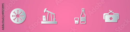 Set paper cut Snowflake, Oil pump or pump jack, Bottle of vodka with glass and Ushanka icon. Paper art style. Vector.