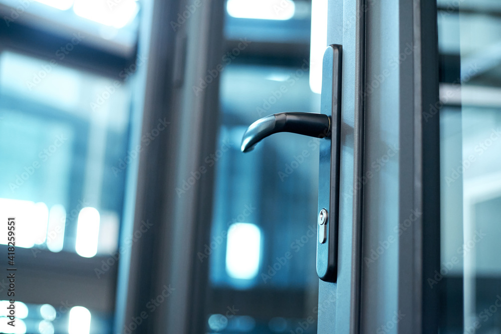 door handle with lock on the glass front door.
