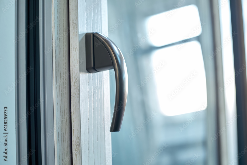 aluminum window detail with stylish chrome handle. aluminum window detail with stylish chrome handle.