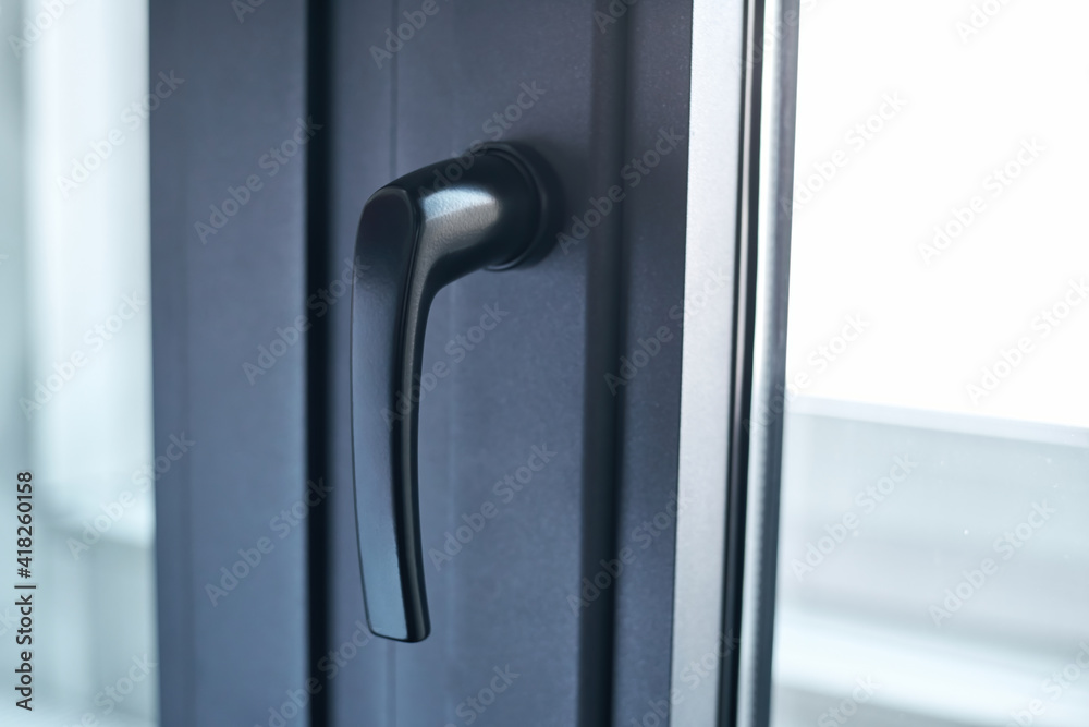 close-up. handle on the balcony window frame. close-up. handle on the balcony window frame.
