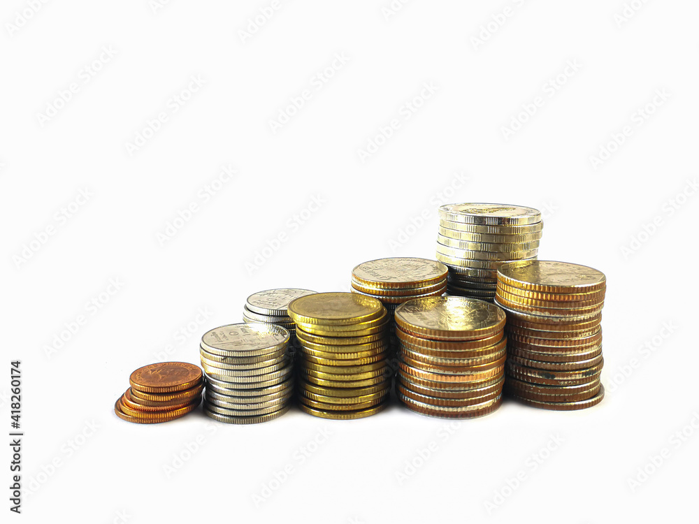 Overlay many coins like graphs on white background for the financial concept. Numerous coins are stacked up on a white background. Overlay many coins like graphs on white background for the financial concept. Numerous coins are stacked up on a white background.