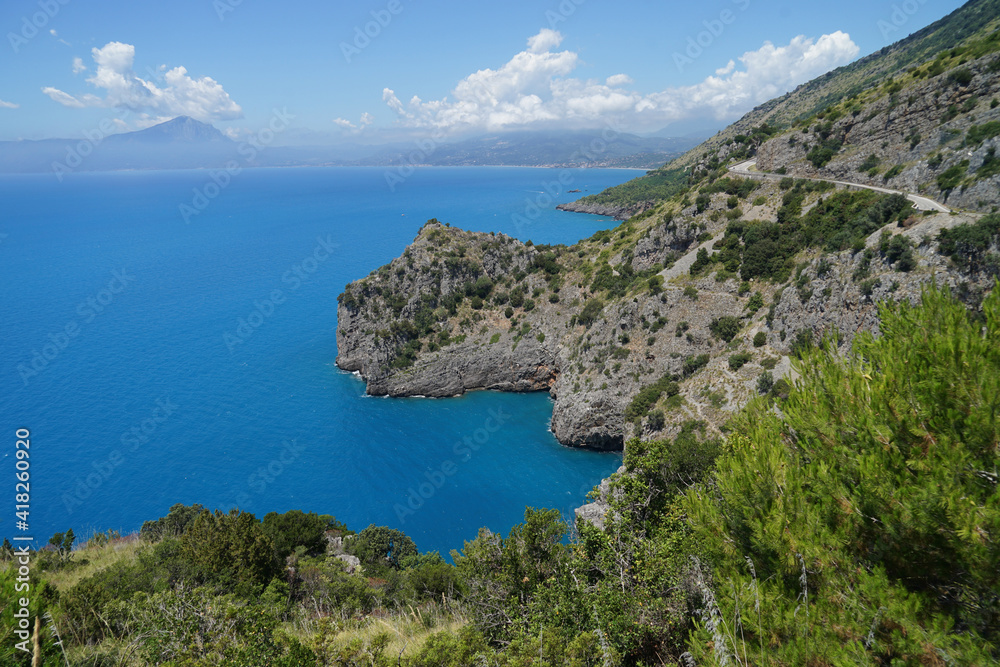 Steep cliffs above blue calm sea, travel holiday concept, Campania, Italy