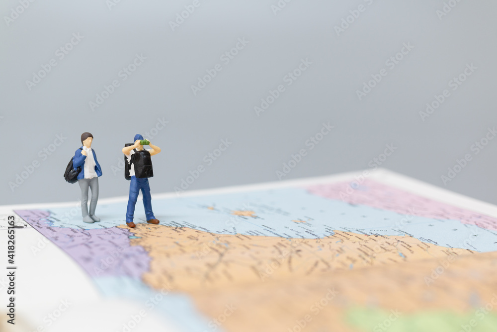 Miniature people Backpacker walking on map Travel and Adventure concepts
Miniature people Backpacker walking on map Travel and Adventure concepts