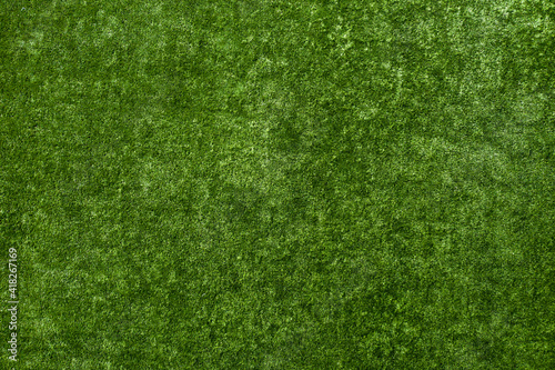 Artificial plastic green lawn or turf texture.