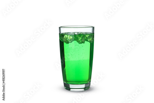 Glass of green soda isolated on white background