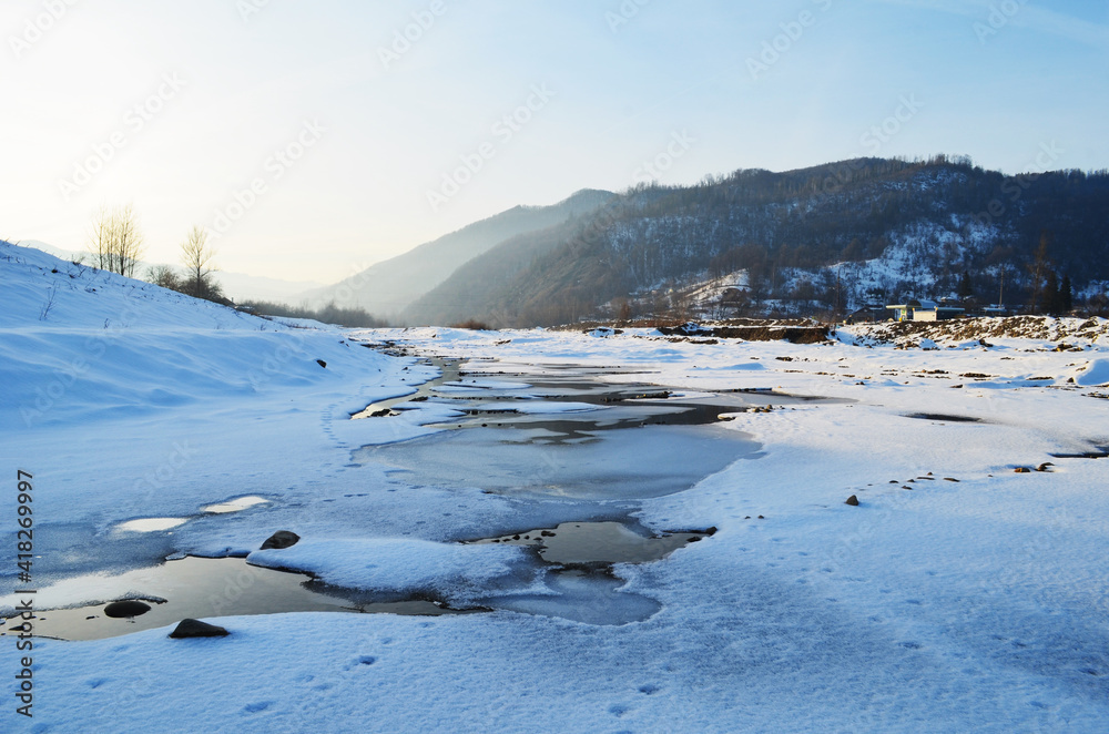Winter landscape with the river in frosty day