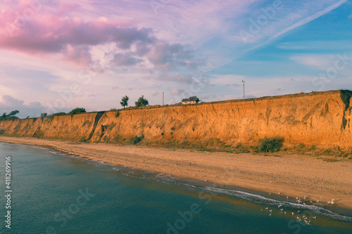 The steep clayey shore of the Black Sea. Odessa region, Ukraine photo