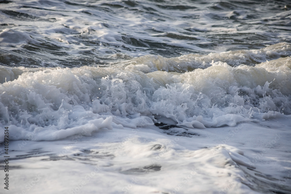 Sea wave close-up. Sea foam. Water spray