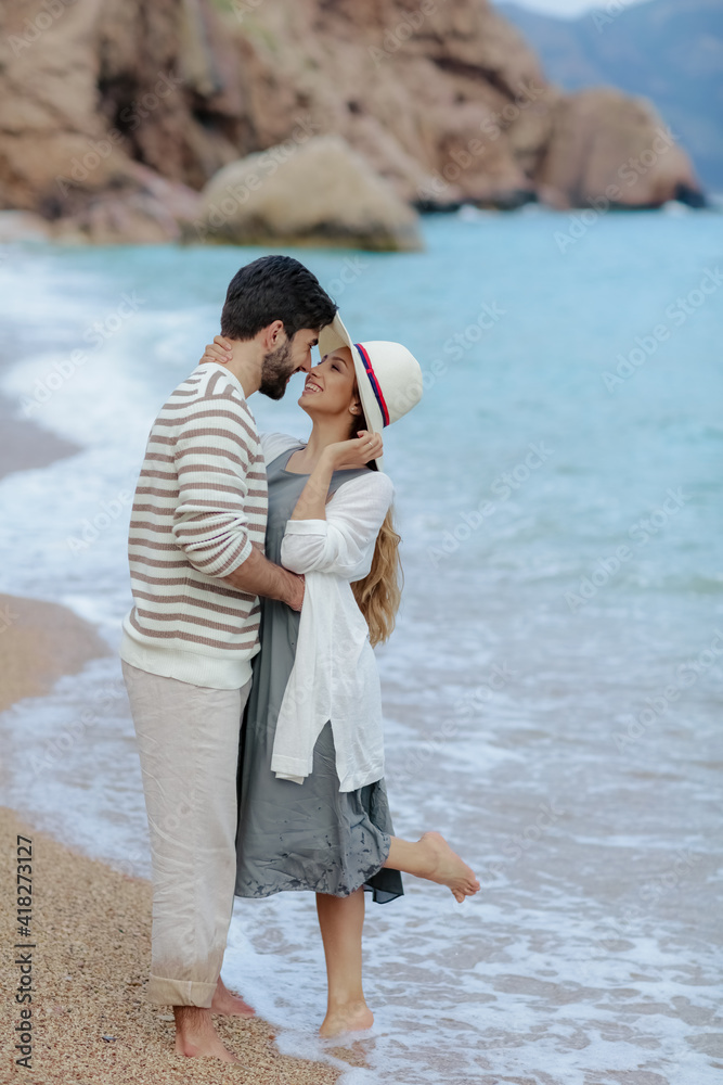 Happy interracial young couple, Woman and Caucasian man. Vacation couple on beach together in love. Happy interracial young couple, Woman and Caucasian man. Vacation couple on beach together in love.