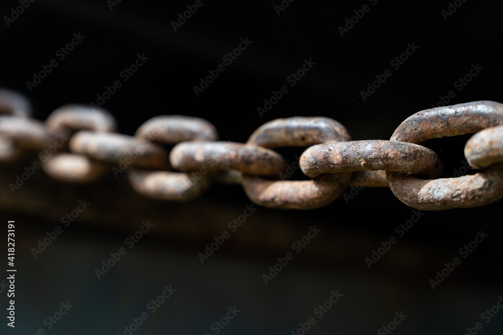 rusty chain from agricultural machinery with dark background rusty chain from agricultural machinery with dark background