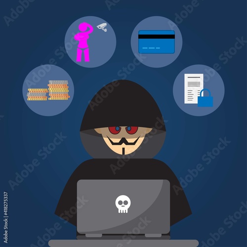 Hacker dressed in black in front of a laptop