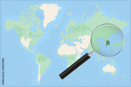 Map of the world with a magnifying glass on a map of South Korea.