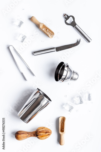 Top view of bar accessories with a cocktail shaker