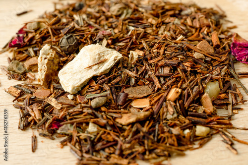 Dry rooibos healthy traditional organic tea with citrus and spices. Macro close-up. High quality photo