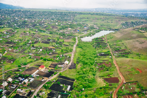 RUSSIA, krasnoyars - 13 JUN, 2020 Aerial view of cottages near the big wood photo