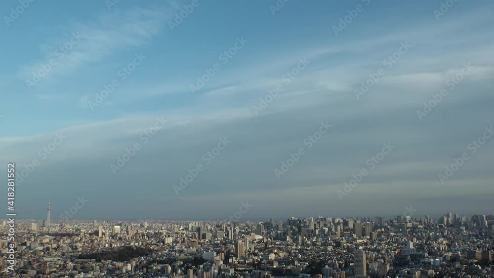 TOKYO, JAPAN : Aerial high angle sunset CITYSCAPE of TOKYO. View of buildings at central downtown area. Japanese city life and urban metropolis concept. Long time lapse tracking shot, dusk to night. TOKYO, JAPAN : Aerial high angle sunset CITYSCAPE of TOKYO. View of buildings at central downtown area. Japanese city life and urban metropolis concept. Long time lapse tracking shot, dusk to night.