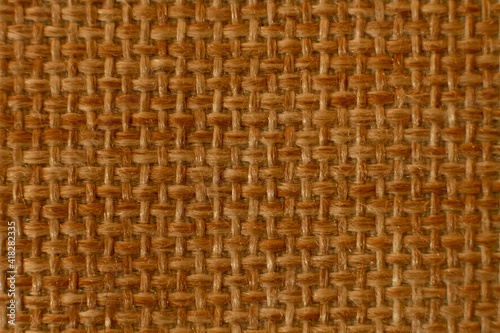 straw tied background. Straw hat knitted material closeup