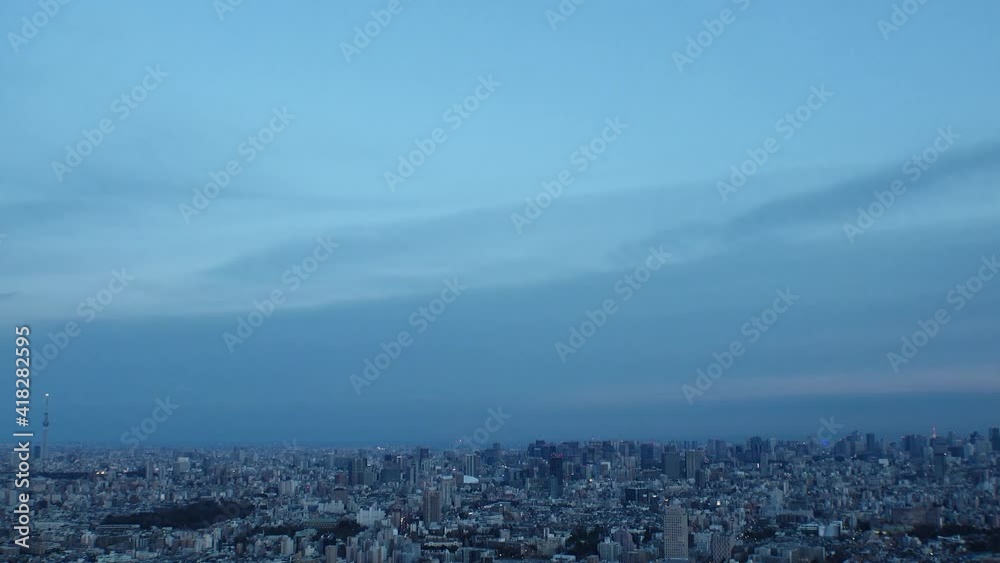 TOKYO, JAPAN : Aerial high angle sunset CITYSCAPE of TOKYO. View of buildings at central downtown area. Japanese city life and urban metropolis concept. Long time lapse tracking shot, dusk to night. TOKYO, JAPAN : Aerial high angle sunset CITYSCAPE of TOKYO. View of buildings at central downtown area. Japanese city life and urban metropolis concept. Long time lapse tracking shot, dusk to night.