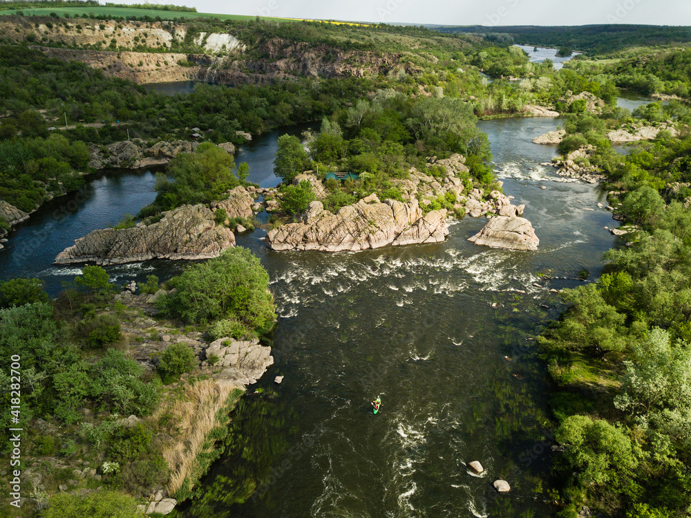 Aerial rocky landscape on Southern Bug River with rapids. Ukraine