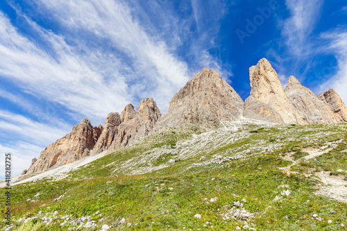 Peaks of the Dolomites against the backdrop of a beautiful blue sky. South Tyrol, Italy