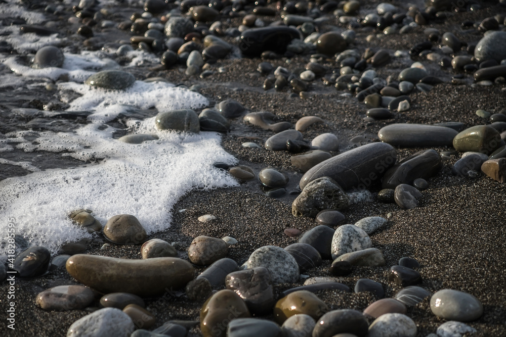 Sea shore with stones and foam, pebble seascape. Sea shore with stones and foam, pebble seascape.