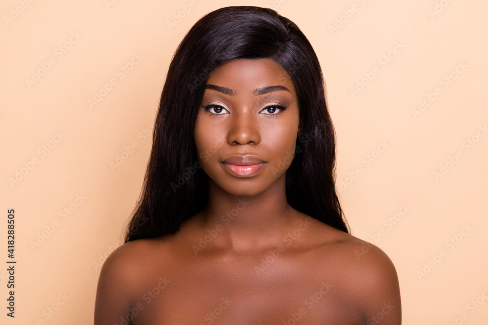 Photo of serious adorable dark skin nude woman silky smooth skin isolated  beige color background Stock Photo