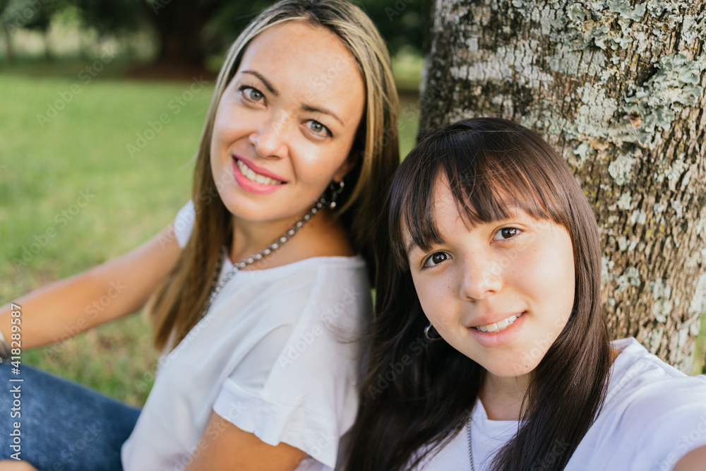 Portrait of Latina mother and daughter in the park. Portrait of Latina mother and daughter in the park.