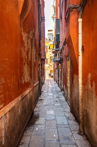Old historic buildings along a narrow street. Venice, Italy