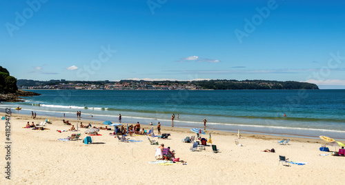 Panoramic summer scene in the beautiful beach of Miño, in the Galicia region of Spain. © Lux Blue