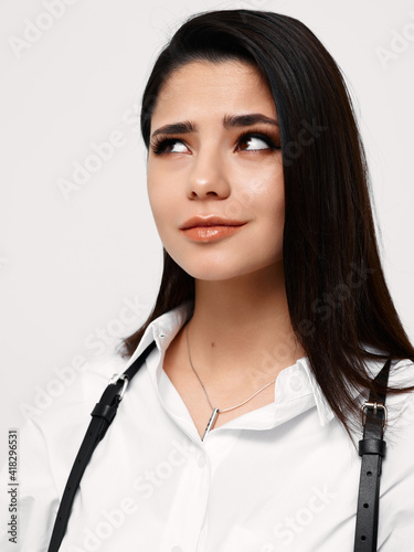 Wallpaper Mural confident brunette woman in white shirt looking to the side on light background Torontodigital.ca