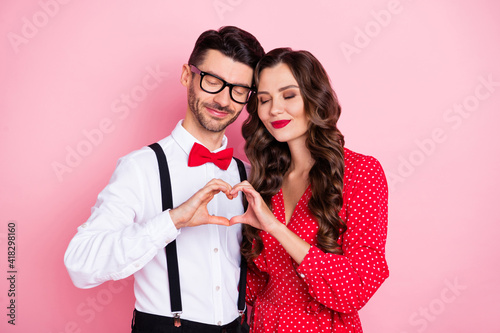 Photo of nice optimistic brown hair couple show heart wear trend cloth isolated on pastel pink color background