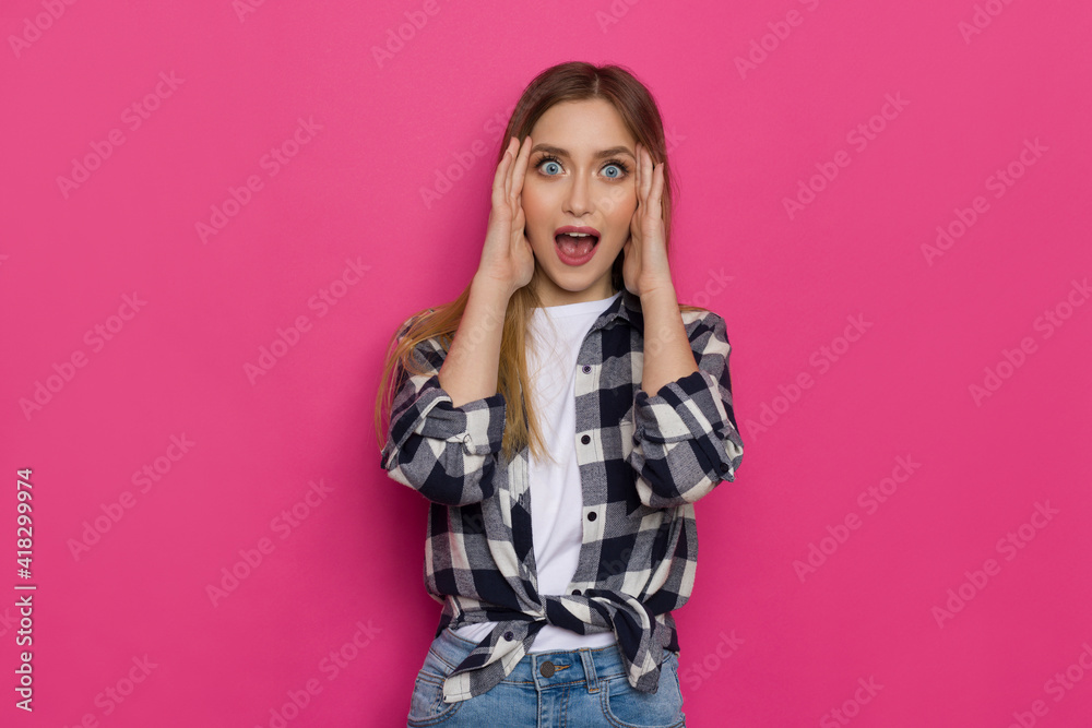 Excited Young Woman Is Holding Head In Hands And Shouting. Excited Young Woman Is Holding Head In Hands And Shouting.