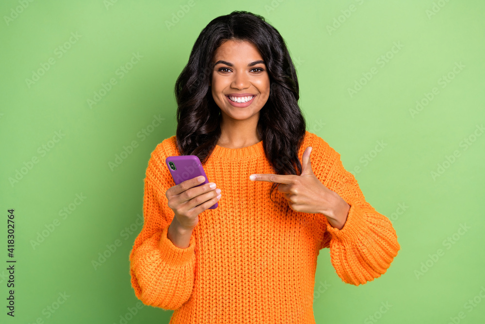Portrait of attractive cheerful girl using gadget demonstrating app 5g fast speed blog isolated over green pastel color background Portrait of attractive cheerful girl using gadget demonstrating app 5g fast speed blog isolated over green pastel color background