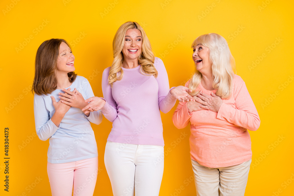 Photo of happy funky women little girl old young lady good mood joke family picture isolated on yellow color background Photo of happy funky women little girl old young lady good mood joke family picture isolated on yellow color background