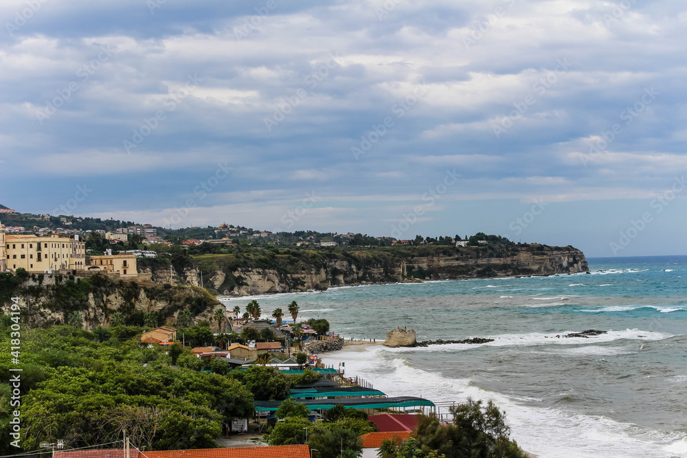 coastline in calabria with blue sky and mediterranean sea
