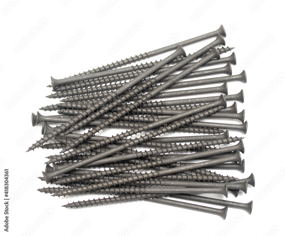 metal screws with long dark thread on white background metal screws with long dark thread on white background