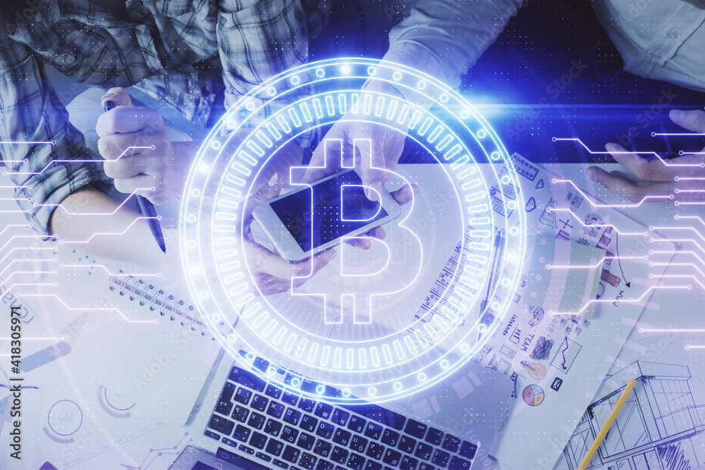Double exposure of crypto theme drawing and man and woman working together holding and using a mobile device. Blockchain concept.