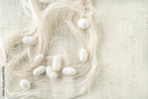 white silkworm cocoons shells, source of silk fabric