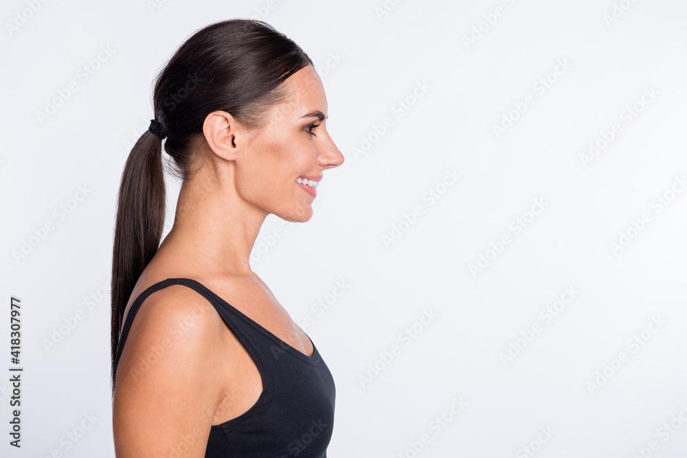 Profile side photo of happy good mood smiling cheerful athlete sporty woman isolated on white color background Profile side photo of happy good mood smiling cheerful athlete sporty woman isolated on white color background