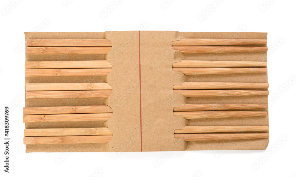 pair of wooden chopsticks isolated on white background, objects are wrapped in paper