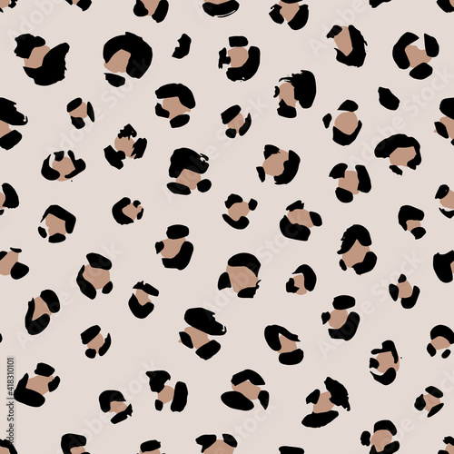 Seamless animal pattern with leopard dots . Creative monochrome texture for fabric, wrapping. Vector illustration © Viktoriia