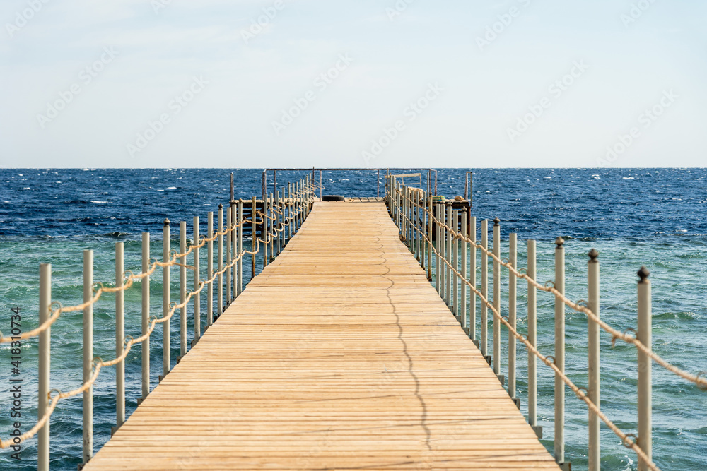 Empty wooden pier over the sea at summer