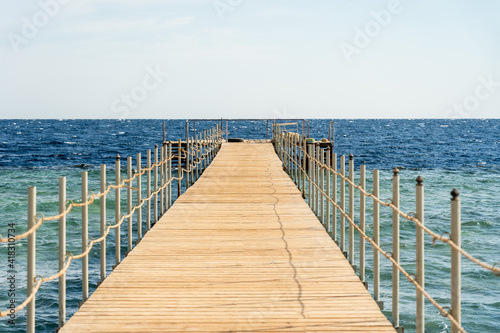 Empty wooden pier over the sea at summer