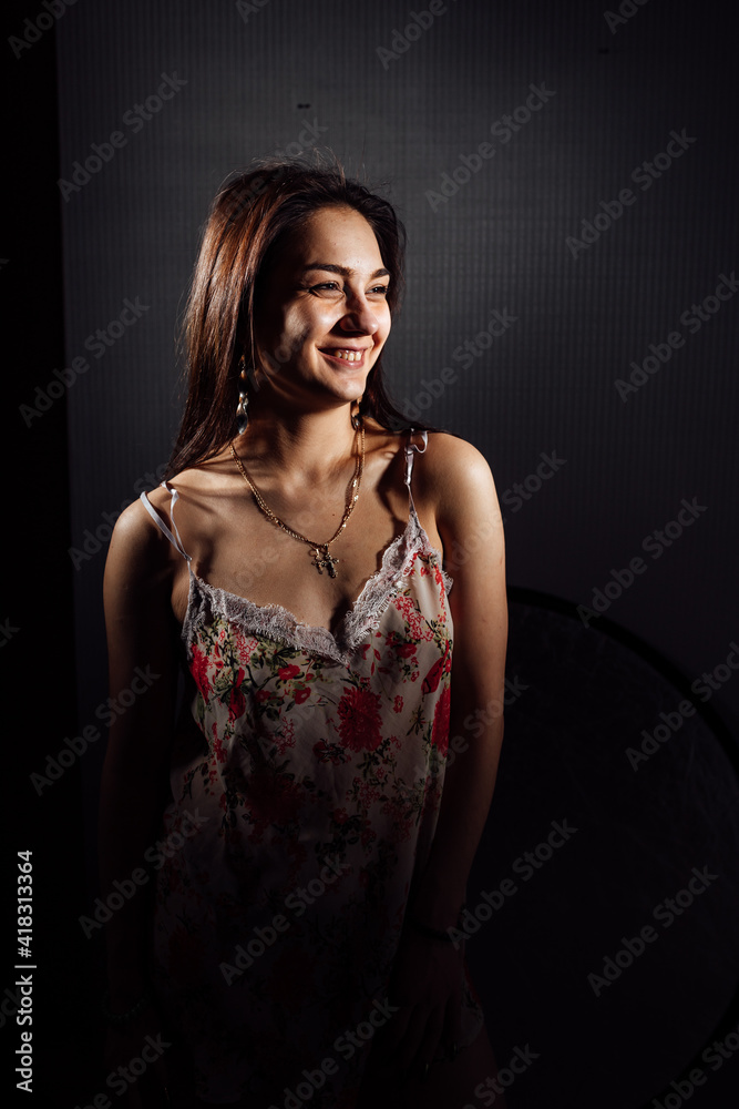 the girl in the studio light. photo session with a professional photographer. portrait in boudoir styles the girl in the studio light. photo session with a professional photographer. portrait in boudoir styles