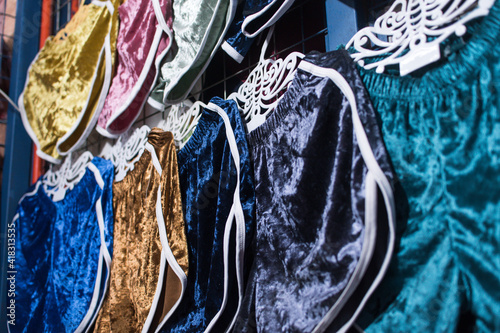 Velvet shorts of assorted colors for sale at a local flea market or boutique clothes store. photo