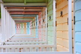 Colorful beach huts in perspective