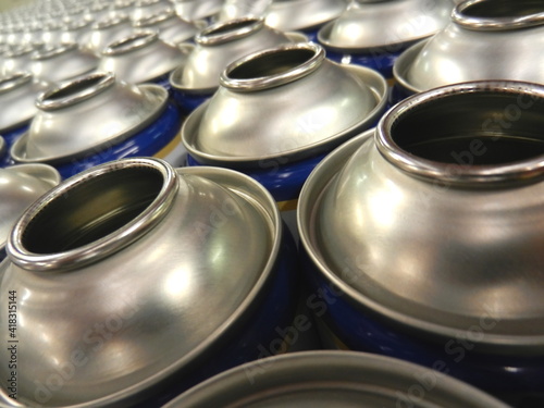 Aerosol cans awaiting production filling process in factory